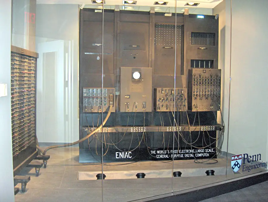 ENIAC, one of the first electronic computers, filling a room with panels of switches and wires