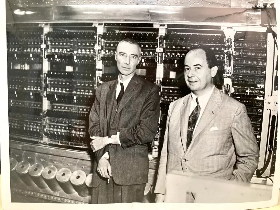 J. Robert Oppenheimer (left) and John von Neumann stand in front of the IAS machine at the Institute for Advanced Study, Princeton, 10 June 1952